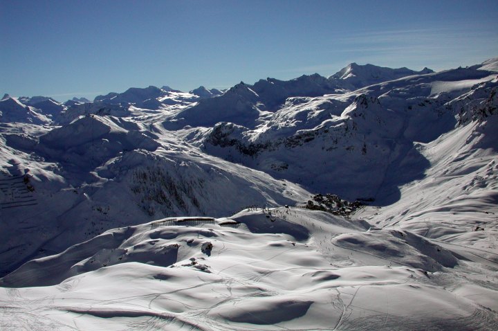 Off with the skis, a bit of a vertical scramble - and the view from the top is beautiful