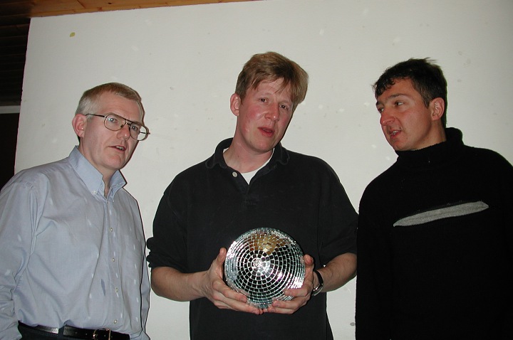 Camera-shy Paul threatens the photographer with a mirror ball suppository